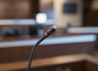 Closeup of microphone in courtroom